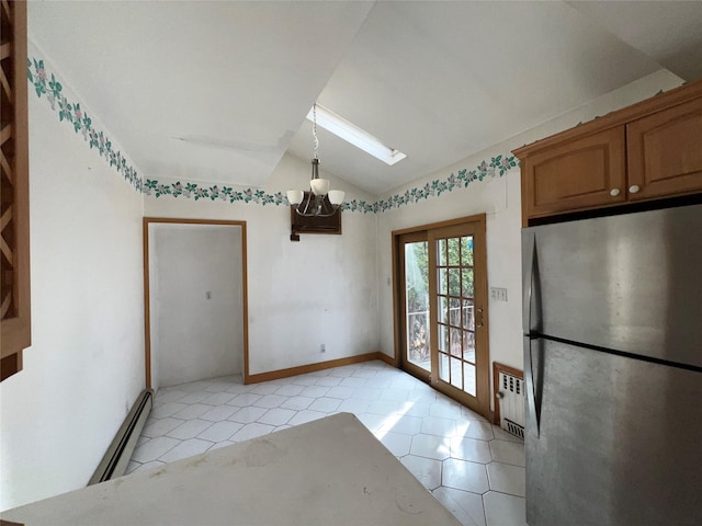 unfurnished dining area with an inviting chandelier, radiator, lofted ceiling with skylight, a baseboard heating unit, and light tile patterned floors
