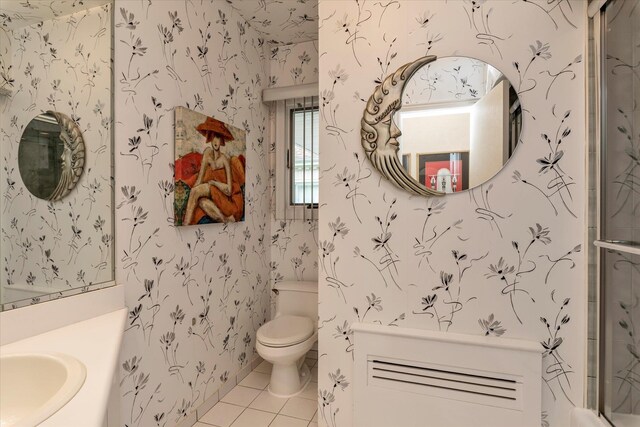1603 Cynthia Ct, Hewlett, NY 11557 - full bathroom with wallpapered walls, tile patterned floors, toilet, vanity, and an enclosed shower