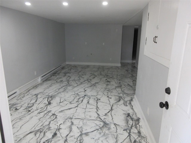 949 E 213th St, Bronx, NY 10469 - unfurnished room featuring a baseboard heating unit, recessed lighting, marble finish floors, and baseboards