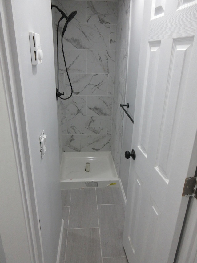 949 E 213th St, Bronx, NY 10469 - bathroom with a marble finish shower and baseboards