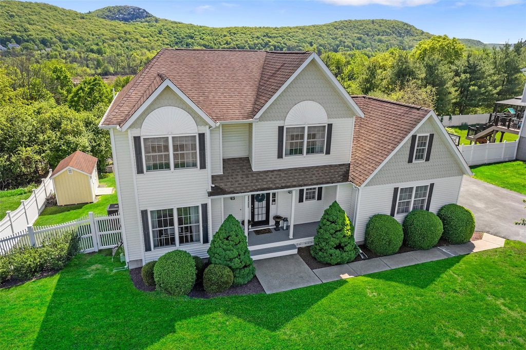 189 Creamery Pond Rd, Chester, NY 10918 - view of front of house featuring covered porch, roof with shingles, a forest view, and a mountain view