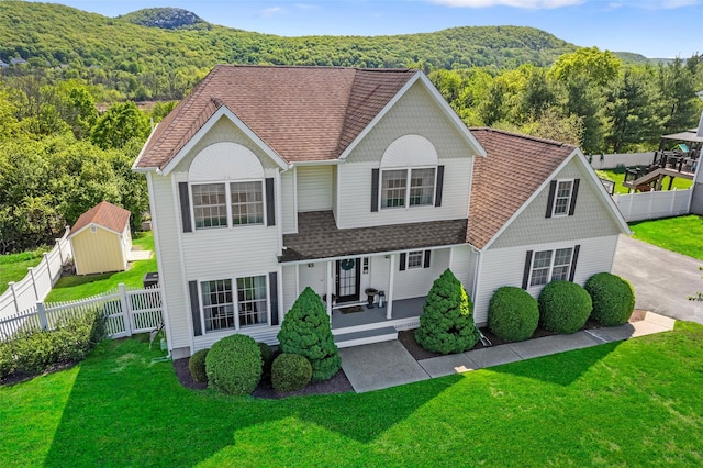 189 Creamery Pond Rd, Chester, NY 10918 - view of front of house featuring covered porch, roof with shingles, a forest view, and a mountain view