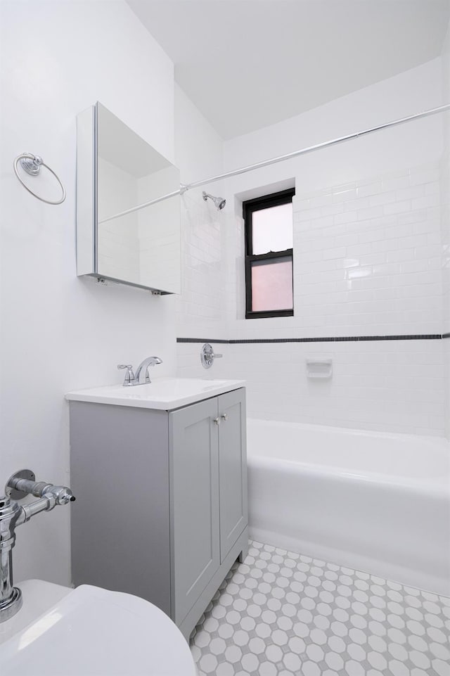 full bathroom featuring vanity, toilet, bathtub / shower combination, and tile patterned floors