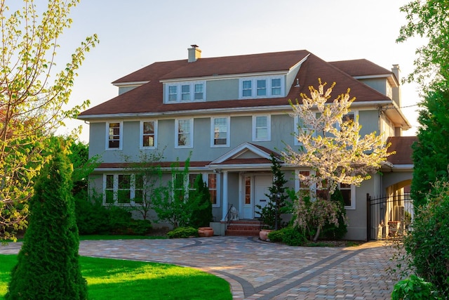 44 S Montgomery Ave, Bay Shore, NY 11706 - view of front of home with stucco siding and a chimney