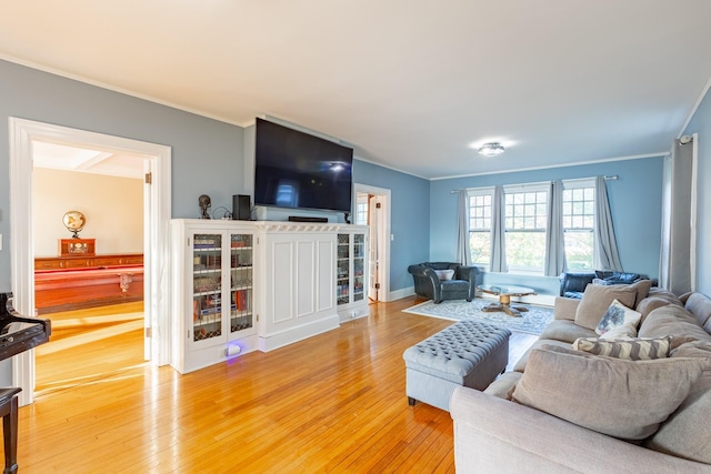 44 S Montgomery Ave, Bay Shore, NY 11706 - living room with crown molding and light wood finished floors
