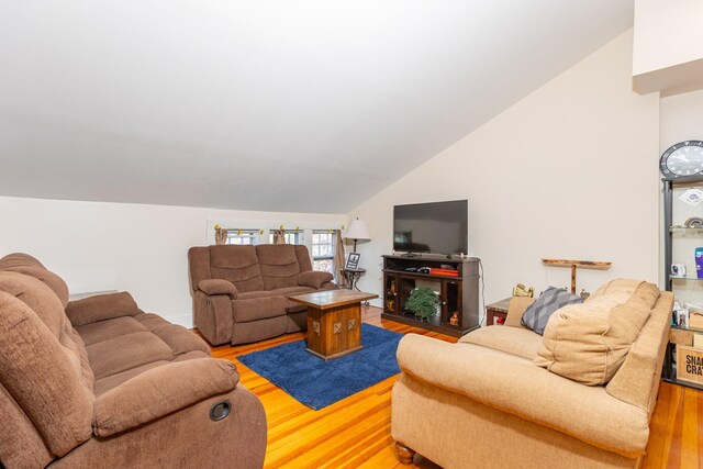 44 S Montgomery Ave, Bay Shore, NY 11706 - living area featuring vaulted ceiling and wood finished floors