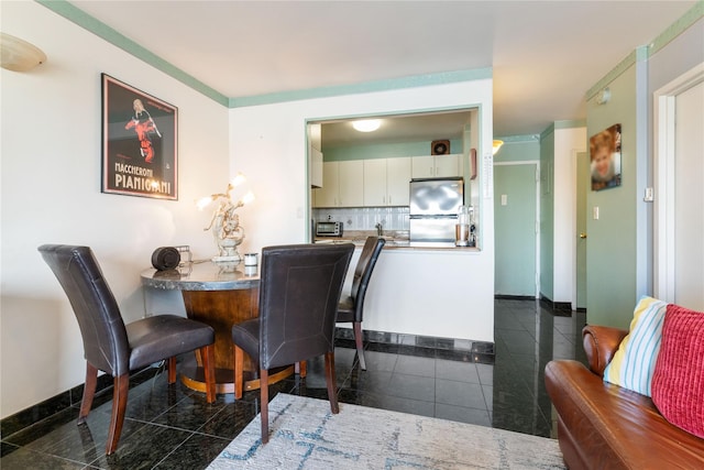 25-40 Shore Blvd Unit 6M, Astoria, NY 11102 - dining space featuring baseboards, granite finish floor, and a toaster