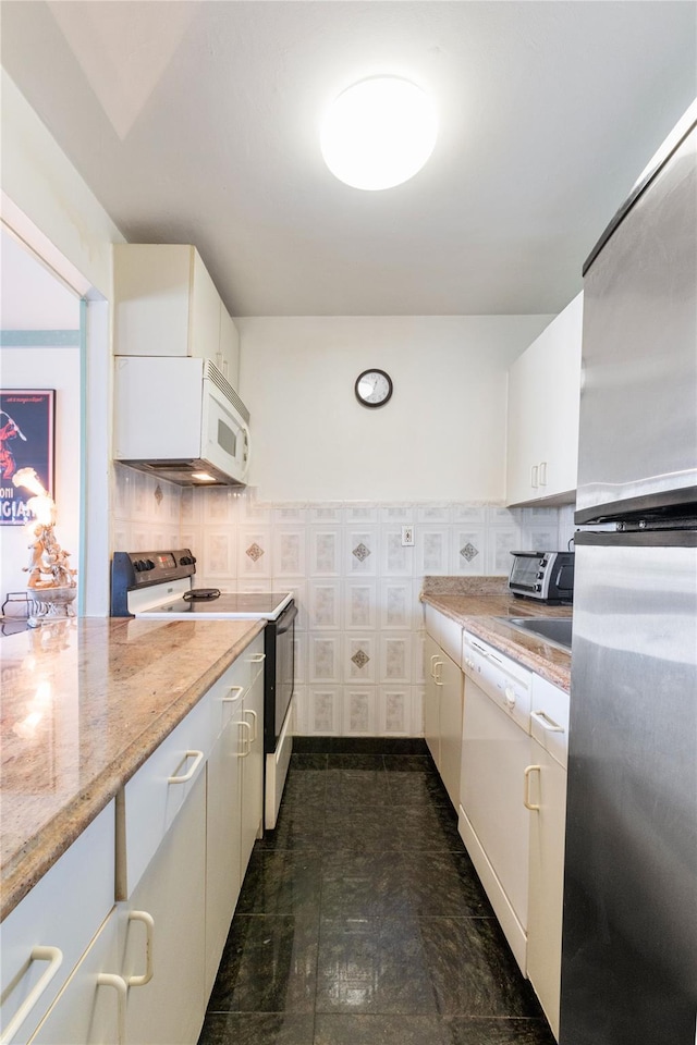 25-40 Shore Blvd Unit 6M, Astoria, NY 11102 - kitchen with white appliances, white cabinetry, light stone countertops, and a toaster