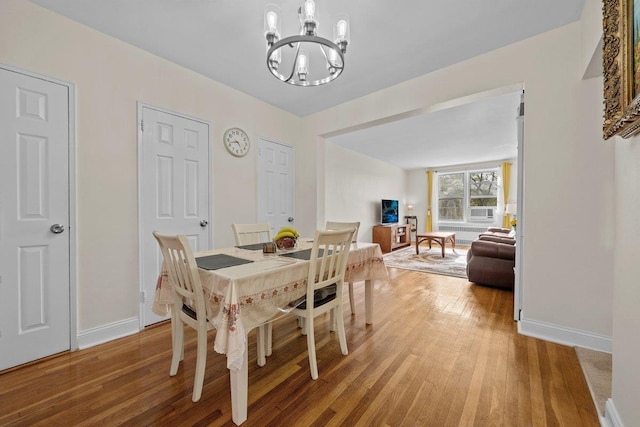 19 Abeel St Unit 6E, Yonkers, NY 10705 - dining room with an inviting chandelier, baseboards, and light wood finished floors