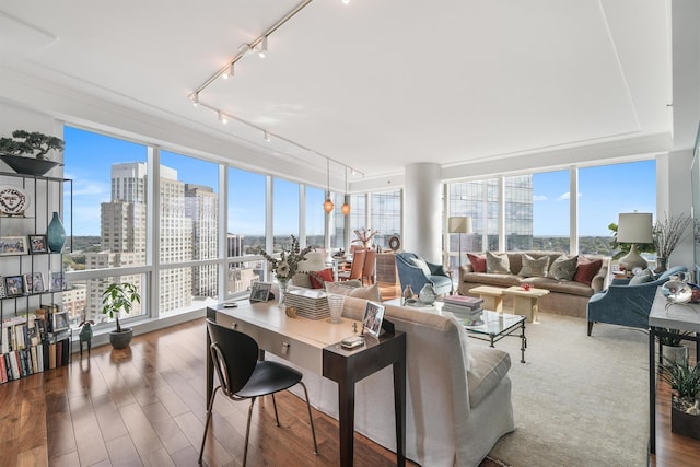 sunroom / solarium with a view of city and rail lighting