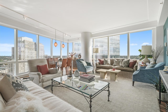 sunroom / solarium with track lighting and a city view