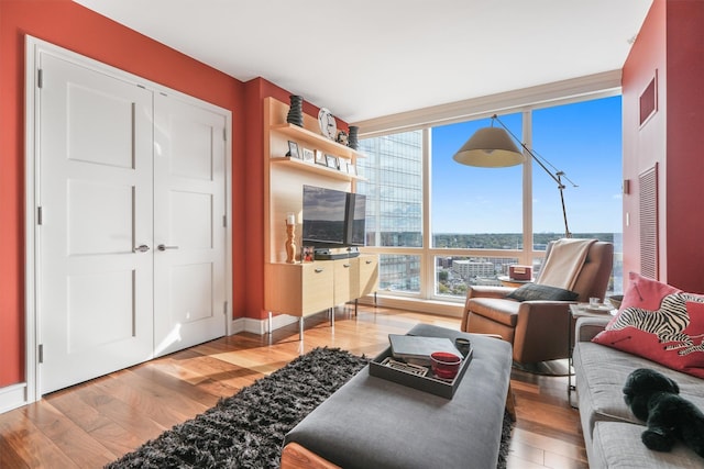 living room featuring baseboards and wood finished floors