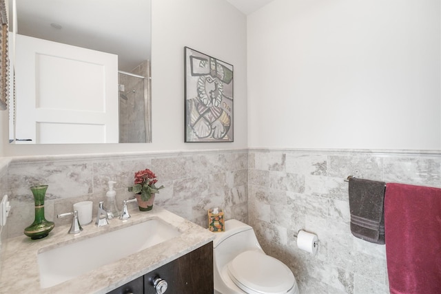 bathroom with toilet, walk in shower, and vanity
