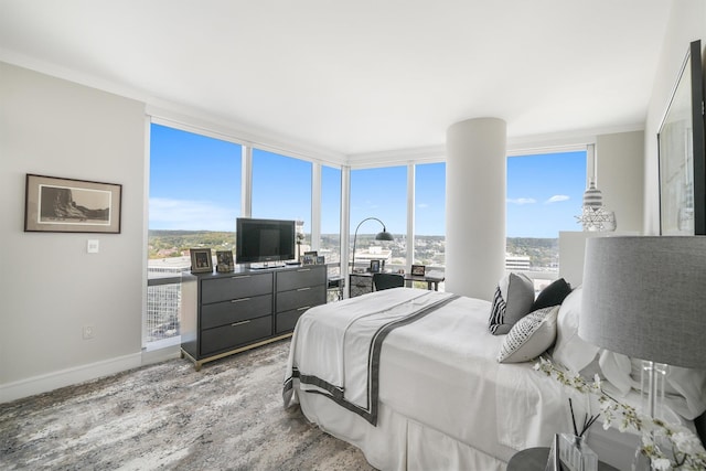 bedroom with baseboards and wood finished floors