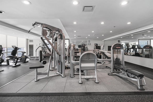 gym featuring recessed lighting and visible vents