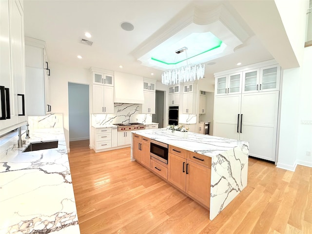 412 Mill River Rd, Oyster Bay, NY 11771 - kitchen with a sink, appliances with stainless steel finishes, light wood-type flooring, and visible vents