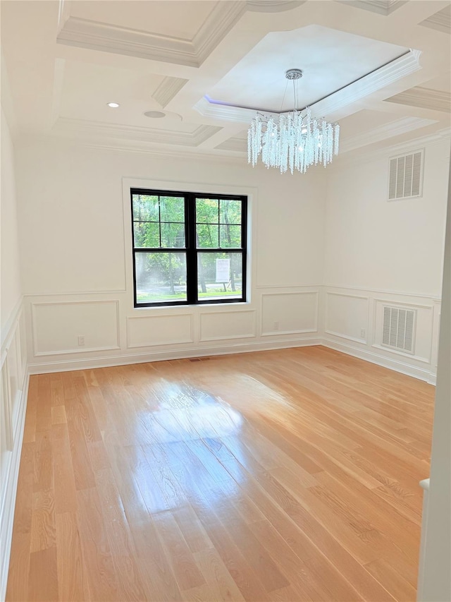 412 Mill River Rd, Oyster Bay, NY 11771 - empty room with an inviting chandelier, coffered ceiling, a decorative wall, and visible vents