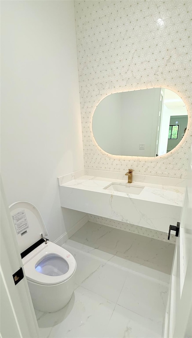412 Mill River Rd, Oyster Bay, NY 11771 - bathroom with vanity, toilet, and marble finish floor