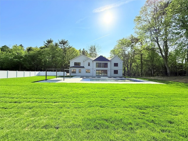 412 Mill River Rd, Oyster Bay, NY 11771 - back of house featuring a fenced in pool, a lawn, fence, and a patio area
