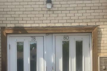 exterior details featuring brick siding