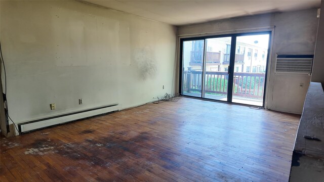 80 Sneden Pl Unit 80, Spring Valley, NY 10977 - empty room with a baseboard heating unit and hardwood / wood-style floors