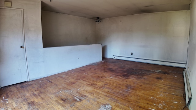 80 Sneden Pl Unit 80, Spring Valley, NY 10977 - unfurnished room featuring baseboard heating and wood-type flooring