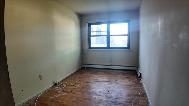 80 Sneden Pl Unit 80, Spring Valley, NY 10977 - spare room featuring hardwood / wood-style floors, a baseboard heating unit, and baseboards