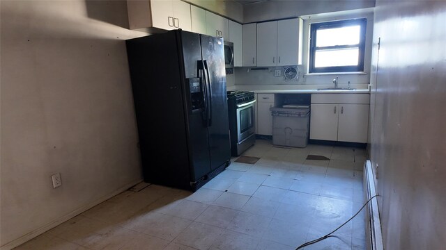 80 Sneden Pl Unit 80, Spring Valley, NY 10977 - kitchen with stainless steel appliances, a sink, light countertops, and white cabinets