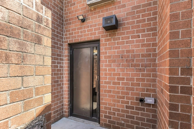 57-15 69th Ln # 2, Maspeth, NY 11378 - view of exterior entry with brick siding
