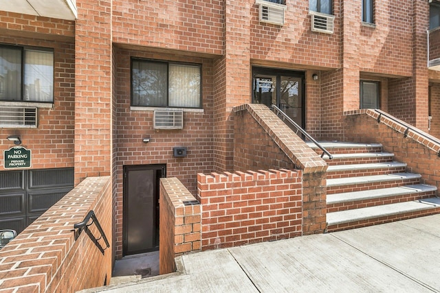 57-15 69th Ln # 2, Maspeth, NY 11378 - doorway to property featuring brick siding
