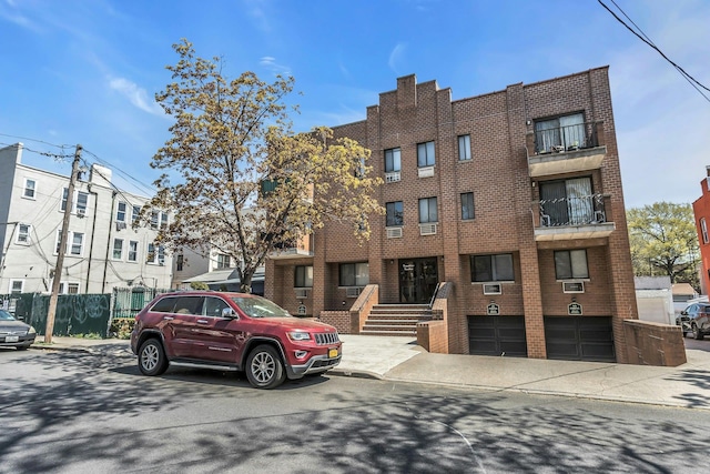 57-15 69th Ln # 2, Maspeth, NY 11378 - view of building exterior with a garage
