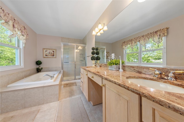 bathroom with healthy amount of natural light, a stall shower, tile patterned flooring, and a garden tub