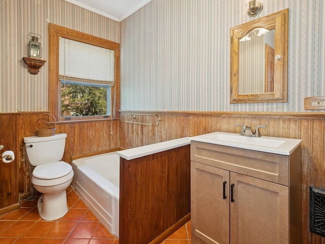 bathroom featuring wainscoting, toilet, and wallpapered walls