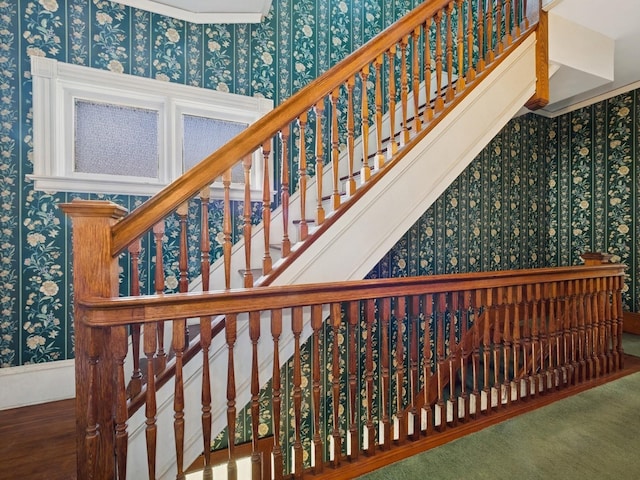 staircase featuring wallpapered walls