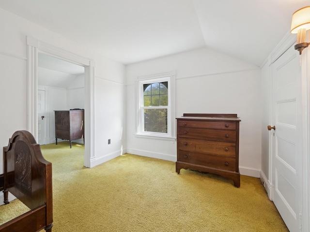 sitting room with baseboards, carpet, and lofted ceiling