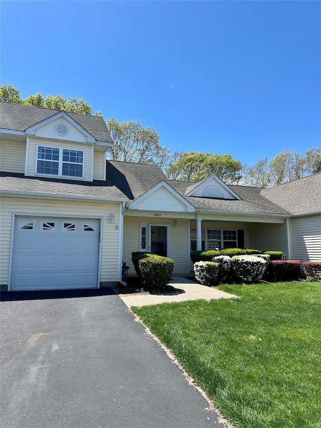 1403 Pebble Beach Path, Riverhead, NY 11901 - view of front of home featuring a front lawn, asphalt driveway, roof with shingles, and an attached garage