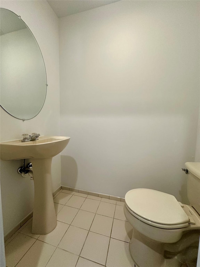 1403 Pebble Beach Path, Riverhead, NY 11901 - bathroom with toilet, baseboards, and tile patterned floors