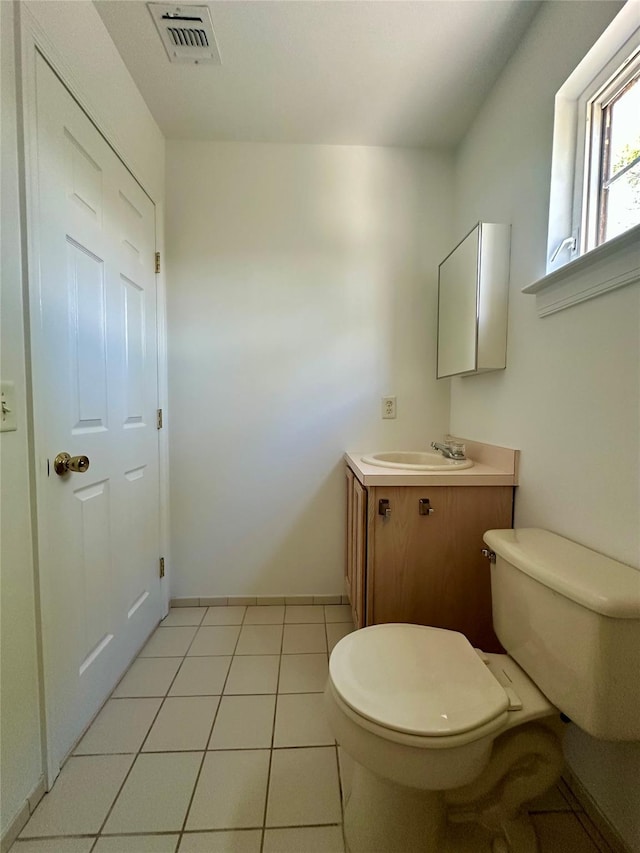 1403 Pebble Beach Path, Riverhead, NY 11901 - half bath with toilet, vanity, tile patterned floors, and baseboards