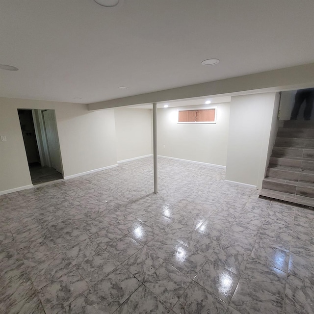basement featuring baseboards and recessed lighting