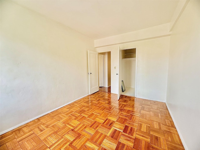 unfurnished room featuring baseboards