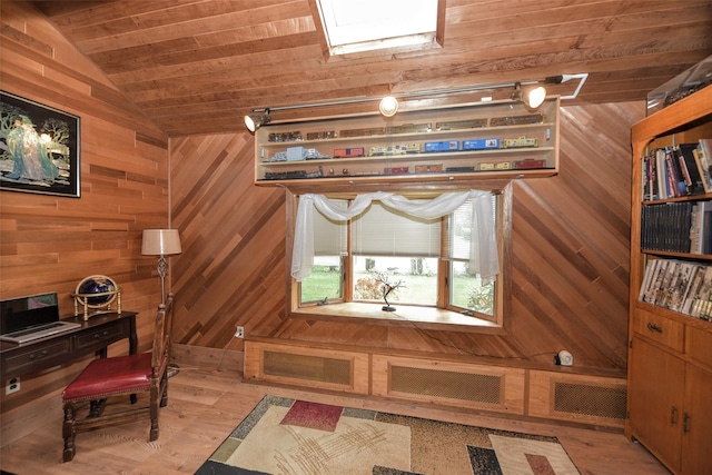 office featuring lofted ceiling, wooden ceiling, wood walls, and light wood-style flooring