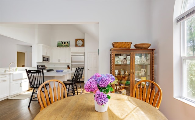 81 Lakeside Ln, Westhampton, NY 11977 - dining area featuring high vaulted ceiling and light wood-style flooring