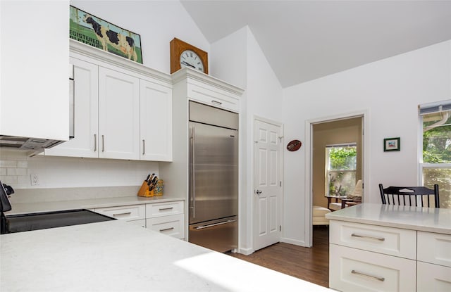 81 Lakeside Ln, Westhampton, NY 11977 - kitchen featuring electric range, lofted ceiling, light countertops, built in refrigerator, and backsplash
