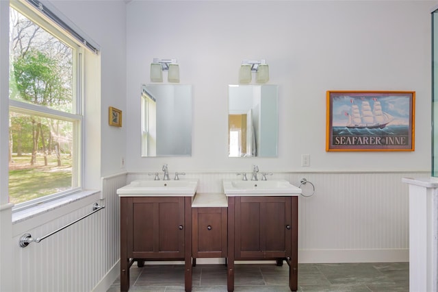 81 Lakeside Ln, Westhampton, NY 11977 - bathroom with vanity, wainscoting, and a wealth of natural light