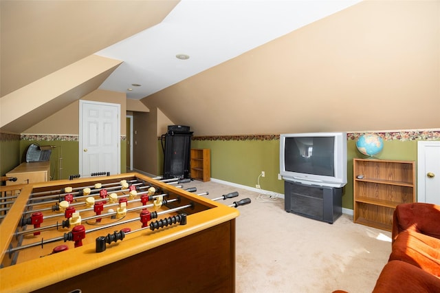playroom with lofted ceiling, carpet, and baseboards
