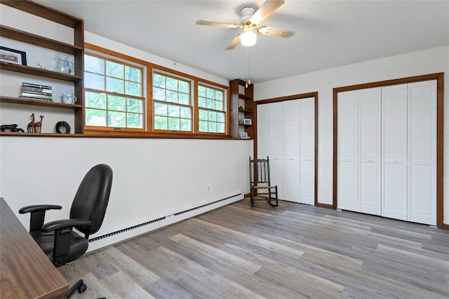 unfurnished office with light wood-style flooring and ceiling fan