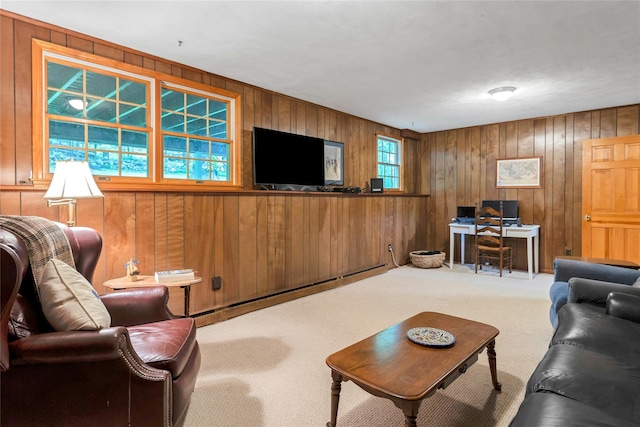 carpeted living room with wood walls and baseboard heating