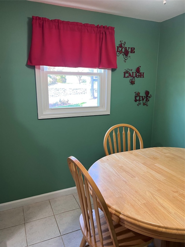 dining space with tile patterned floors and baseboards