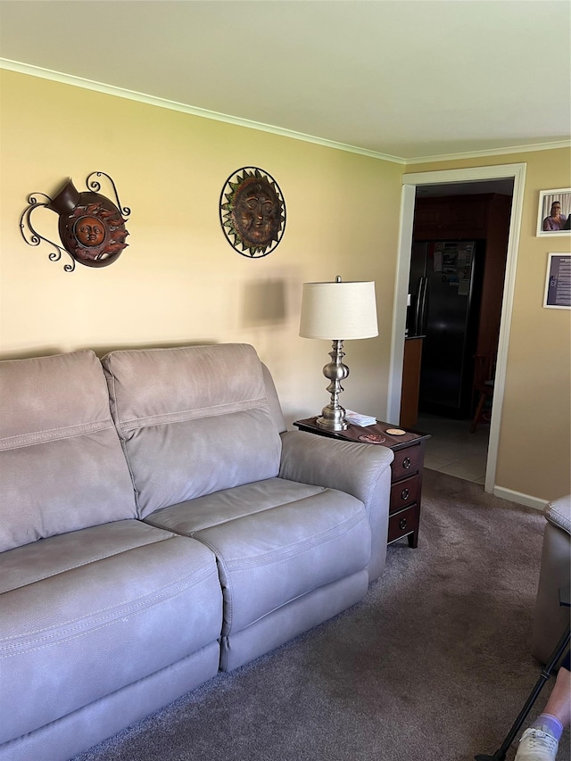 living room featuring dark carpet, ornamental molding, and baseboards