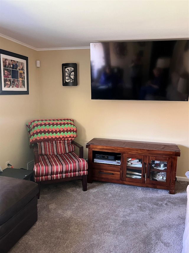carpeted living area featuring crown molding